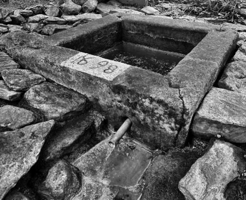 A mineral spring drained into a historic basin. A mineral spring drained into a historic basin.